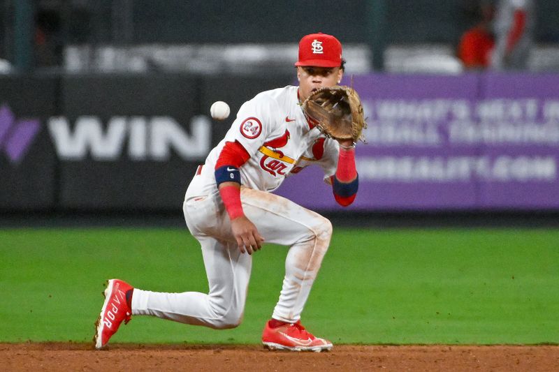 Sep 11, 2024; St. Louis, Missouri, USA;  St. Louis Cardinals shortstop Masyn Winn (0) fields a ground ball against the Cincinnati Reds during the sixth inning at Busch Stadium. Mandatory Credit: Jeff Curry-Imagn Images