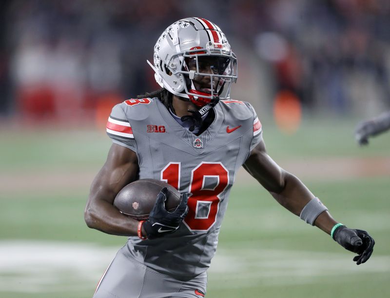 Nov 11, 2023; Columbus, Ohio, USA;  Ohio State Buckeyes wide receiver Marvin Harrison Jr. (18) scores the touchdown during the first quarter against the Michigan State Spartans at Ohio Stadium. Mandatory Credit: Joseph Maiorana-USA TODAY Sports