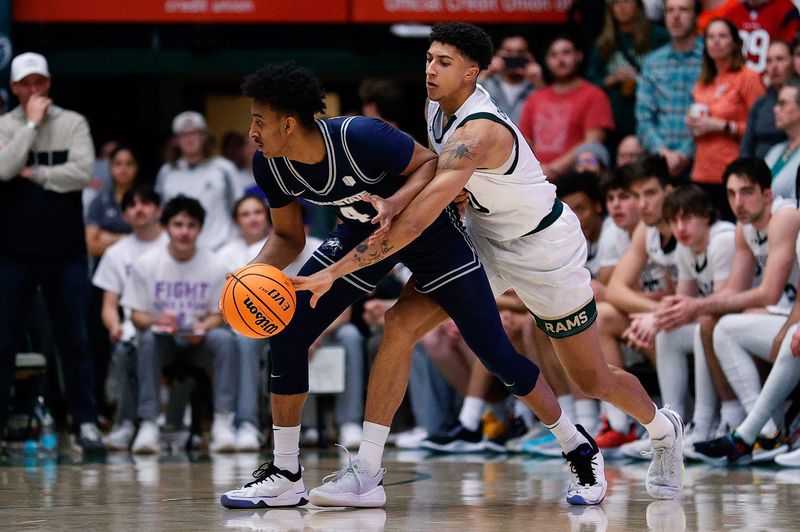 Mar 1, 2025; Fort Collins, Colorado, USA; Colorado State Rams guard Nique Clifford (10) knocks the ball away from Utah State Aggies guard Ian Martinez (4) in the first half at Moby Arena. Mandatory Credit: Isaiah J. Downing-Imagn Images