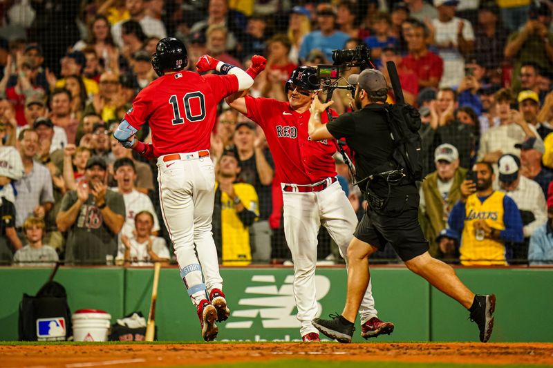 Aug 25, 2023; Boston, Massachusetts, USA; Boston Red Sox shortstop Trevor Story (10) reacts with teammates after hitting a two run home run against the Los Angeles Dodgers in the second inning at Fenway Park. Mandatory Credit: David Butler II-USA TODAY Sports