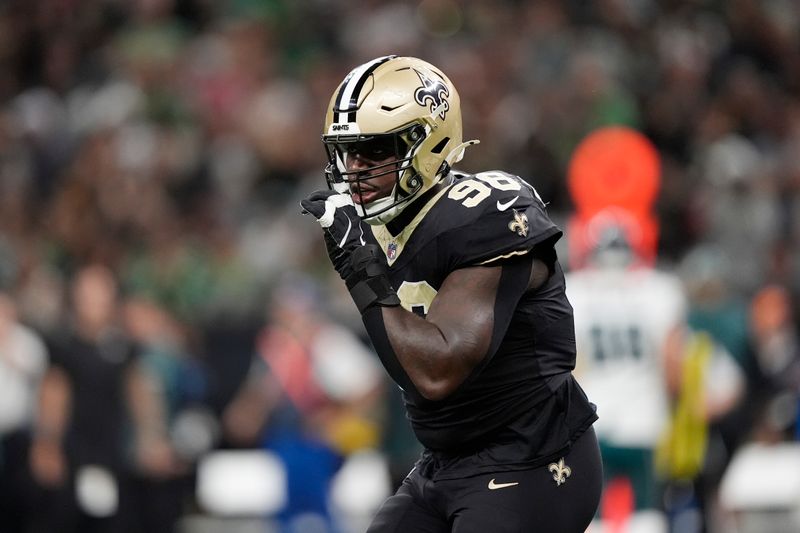 New Orleans Saints defensive end Carl Granderson celebrates a sack against the Philadelphia Eagles in the first half of an NFL football game in New Orleans, Sunday, Sept. 22, 2024. (AP Photo/Gerald Herbert)