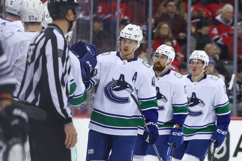 Jan 6, 2024; Newark, New Jersey, USA; Vancouver Canucks center Elias Pettersson (40) celebrates his goal against the New Jersey Devils during the second period at Prudential Center. Mandatory Credit: Ed Mulholland-USA TODAY Sports