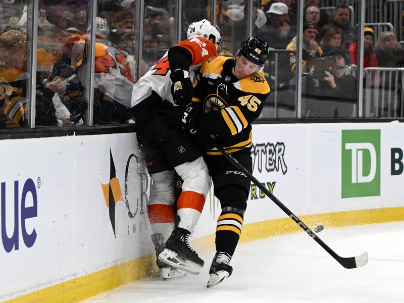 Oct 29, 2024; Boston, Massachusetts, USA; Boston Bruins left wing Cole Koepke (45) checks Philadelphia Flyers defenseman Nick Seeler (24) into the boards during the first period at TD Garden. Mandatory Credit: Brian Fluharty-Imagn Images