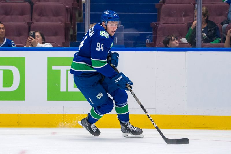 Sep 24, 2024; Vancouver, British Columbia, CAN; Vancouver Canucks forward Linus Karlsson (94) handles the puck against the Seattle Kraken during the third period at Rogers Arena. Mandatory Credit: Bob Frid-Imagn Images