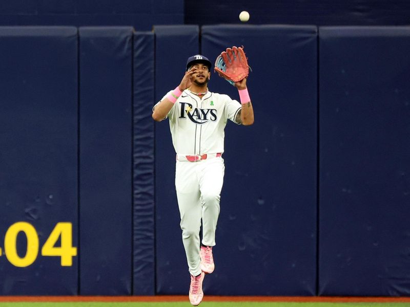 May 30, 2024; St. Petersburg, Florida, USA; Tampa Bay Rays outfielder Jose Siri (22) catches a fly ball against the Oakland Athletics during the first inning at Tropicana Field. Mandatory Credit: Kim Klement Neitzel-USA TODAY Sports