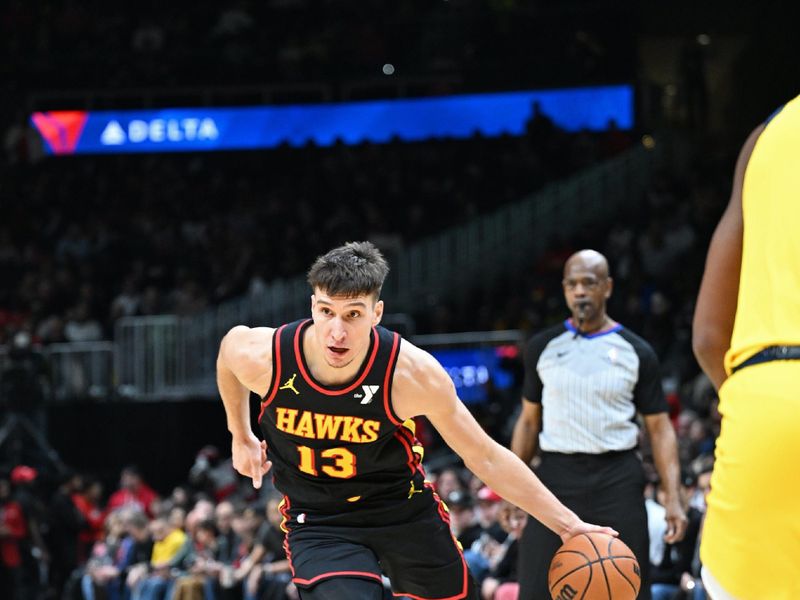 ATLANTA, GA - JANUARY 12: Bogdan Bogdanovic #13 of the Atlanta Hawks drives to the basket during the game against the Indiana Pacers on January 12, 2024 at State Farm Arena in Atlanta, Georgia.  NOTE TO USER: User expressly acknowledges and agrees that, by downloading and/or using this Photograph, user is consenting to the terms and conditions of the Getty Images License Agreement. Mandatory Copyright Notice: Copyright 2024 NBAE (Photo by Adam Hagy/NBAE via Getty Images)