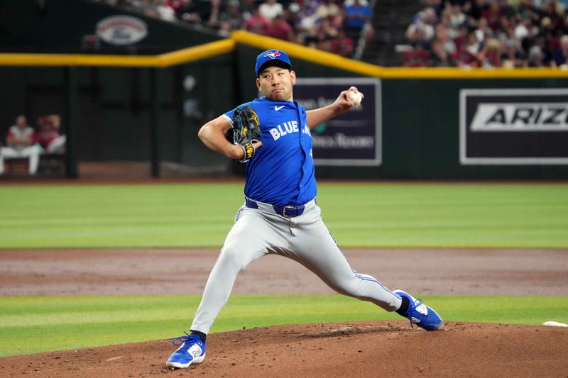 Jul 14, 2024; Phoenix, Arizona, USA; Toronto Blue Jays pitcher Yusei Kikuchi (16) pitches against the Arizona Diamondbacks during the first inning at Chase Field. Mandatory Credit: Joe Camporeale-USA TODAY Sports