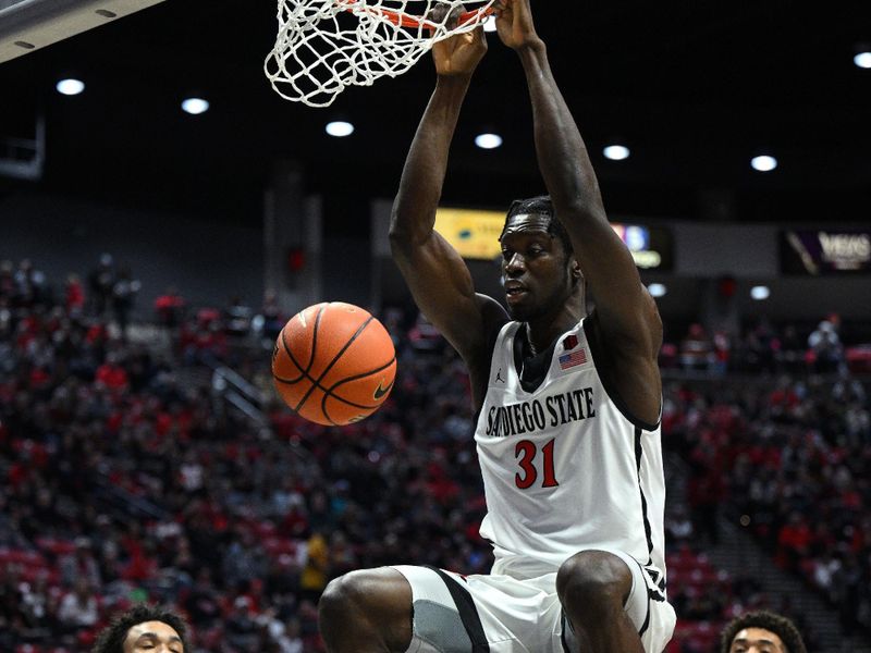 Jan 14, 2023; San Diego, California, USA; San Diego State Aztecs forward Nathan Mensah (31) dunks the ball during the first half against the New Mexico Lobos at Viejas Arena. Mandatory Credit: Orlando Ramirez-USA TODAY Sports