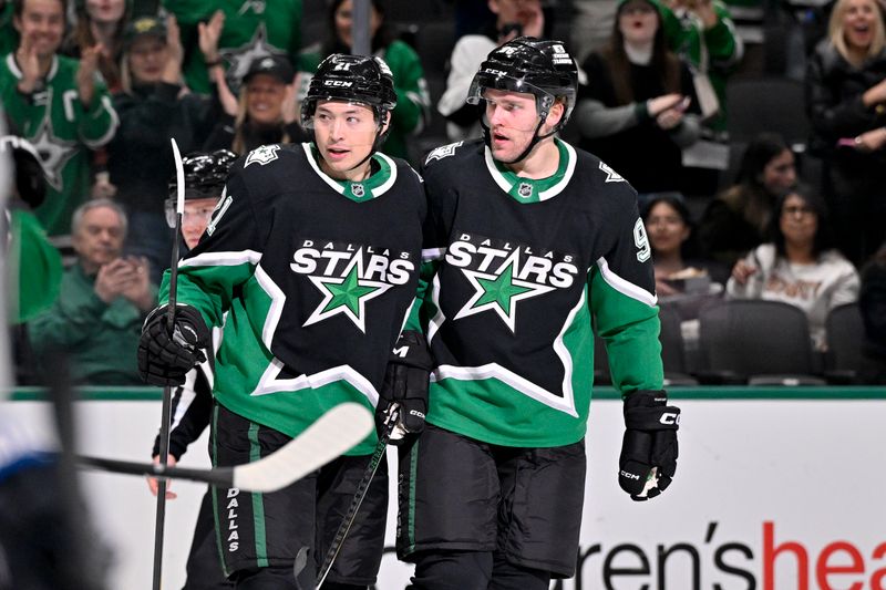 Feb 2, 2026; Dallas, Texas, USA; Dallas Stars left wing Jason Robertson (21) and right wing Mikko Rantanen (96) celebrates a power play goal scored by Robertson against the Winnipeg Jets during the second period at the American Airlines Center. Mandatory Credit: Jerome Miron-Imagn Images