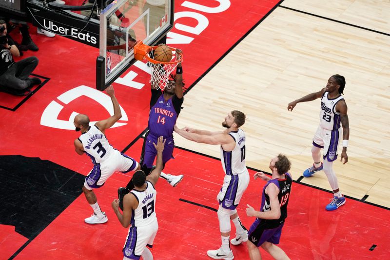 TORONTO, CANADA - NOVEMBER 2: Ja'Kobe Walter #14 of the Toronto Raptors drives to the basket during the game against the Sacramento Kings on November 2, 2024 at the Scotiabank Arena in Toronto, Ontario, Canada.  NOTE TO USER: User expressly acknowledges and agrees that, by downloading and or using this Photograph, user is consenting to the terms and conditions of the Getty Images License Agreement.  Mandatory Copyright Notice: Copyright 2024 NBAE (Photo by Andrew Lahodynskyj/NBAE via Getty Images)