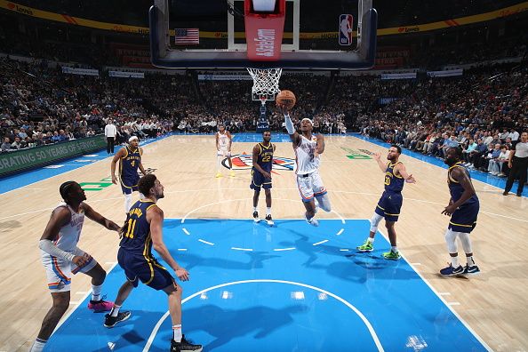 OKLAHOMA CITY, OK - DECEMBER 8: Shai Gilgeous-Alexander #2 of the Oklahoma City Thunder drives to the basket during the game against the Golden State Warriors on December 8, 2023 at Paycom Arena in Oklahoma City, Oklahoma. NOTE TO USER: User expressly acknowledges and agrees that, by downloading and or using this photograph, User is consenting to the terms and conditions of the Getty Images License Agreement. Mandatory Copyright Notice: Copyright 2023 NBAE (Photo by Zach Beeker/NBAE via Getty Images)