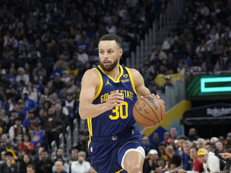 SAN FRANCISCO, CALIFORNIA - FEBRUARY 23: Stephen Curry #30 of the Golden State Warriors dribbles the ball up court against the Charlotte Hornets in the second quarter of an NBA basketball game at Chase Center on February 23, 2024 in San Francisco, California. NOTE TO USER: User expressly acknowledges and agrees that, by downloading and or using this photograph, User is consenting to the terms and conditions of the Getty Images License Agreement. (Photo by Thearon W. Henderson/Getty Images)