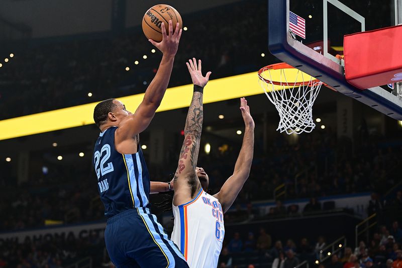 OKLAHOMA CITY, OKLAHOMA - DECEMBER 18: Desmond Bane #22 of the Memphis Grizzlies rises up for a shot at the rim during the first half against the Oklahoma City Thunder at Paycom Center on December 18, 2023 in Oklahoma City, Oklahoma. NOTE TO USER: User expressly acknowledges and agrees that, by downloading and or using this Photograph, user is consenting to the terms and conditions of the Getty Images License Agreement. (Photo by Joshua Gateley/Getty Images)