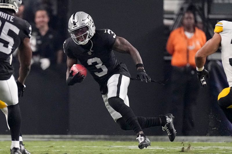 Las Vegas Raiders wide receiver DeAndre Carter runs the ball during an NFL football game against the Pittsburgh Steelers Sunday, Sept. 24, 2023, in Las Vegas. (AP Photo/Mark J. Terrill)