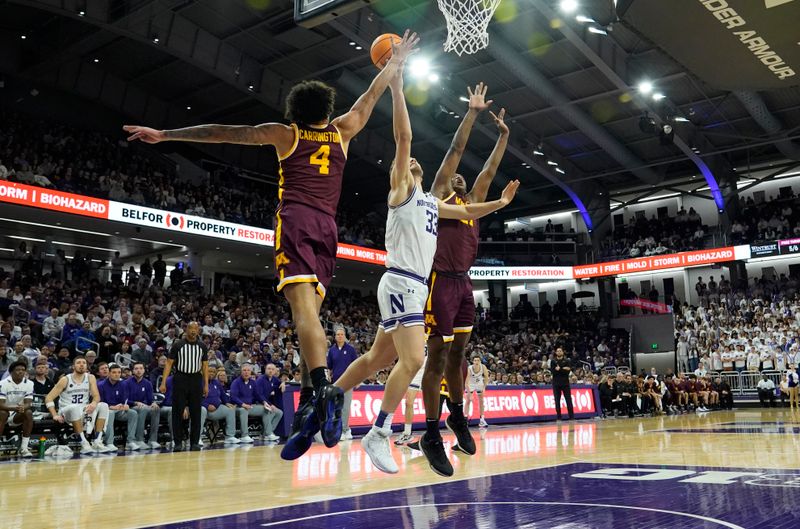 Mar 9, 2024; Evanston, Illinois, USA;Minnesota Golden Gophers guard Braeden Carrington (4) defends Northwestern Wildcats forward Luke Hunger (33) during the second half at Welsh-Ryan Arena. Mandatory Credit: David Banks-USA TODAY Sports