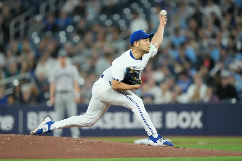 Apr 16, 2024; Toronto, Ontario, CAN; Toronto Blue Jays starting pitcher Yusei Kikuchi (16) pitches to the New York Yankees during the first inning at Rogers Centre. Mandatory Credit: John E. Sokolowski-USA TODAY Sports