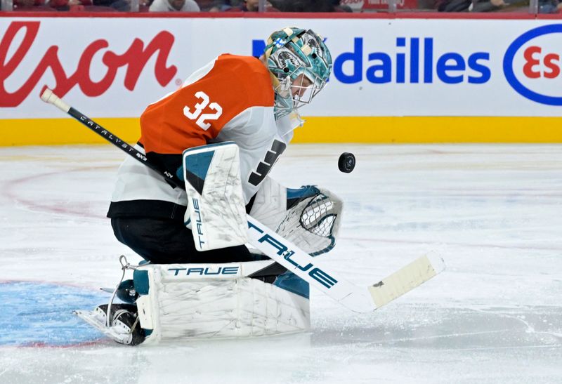 Sep 23, 2024; Montreal, Quebec, CAN; Philadelphia Flyers goalie Eetu Makiniemi (32) makes a save against the Montreal Canadiens during the second period at the Bell Centre. Mandatory Credit: Eric Bolte-Imagn Images