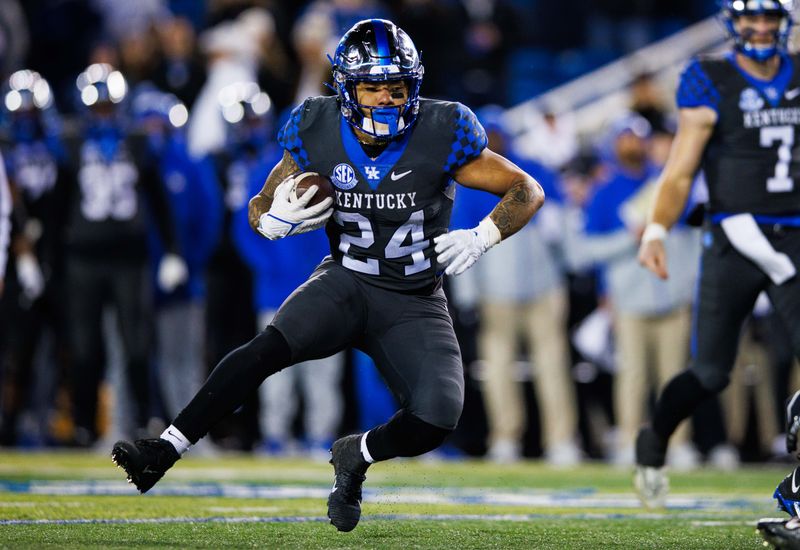 Nov 19, 2022; Lexington, Kentucky, USA; Kentucky Wildcats running back Chris Rodriguez Jr. (24) runs the ball during the fourth quarter against the Georgia Bulldogs at Kroger Field. Mandatory Credit: Jordan Prather-USA TODAY Sports