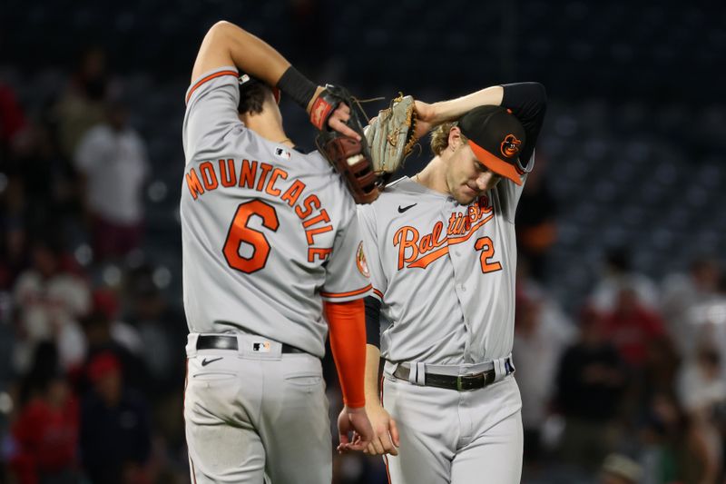 Sep 6, 2023; Anaheim, California, USA; Baltimore Orioles first baseman Ryan Mountcastle (6) and third baseman Gunnar Henderson (2) celebrate a victory after defeating the Los Angeles Angels 10-3 at Angel Stadium. Mandatory Credit: Kiyoshi Mio-USA TODAY Sports