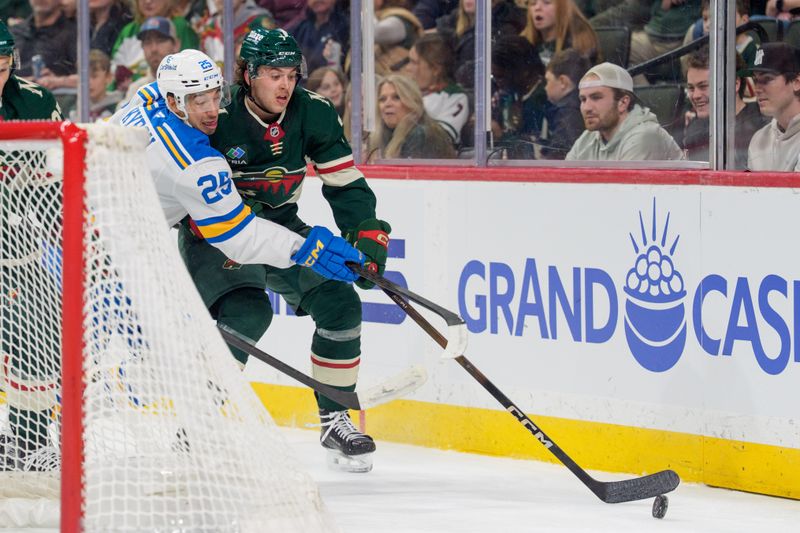 Mar 1, 2026; Saint Paul, Minnesota, USA; St. Louis Blues right wing Jordan Kyrou (25) presses Minnesota Wild defenseman Brock Faber (7) behind the net in the first period at Grand Casino Arena. Mandatory Credit: Matt Blewett-Imagn Images