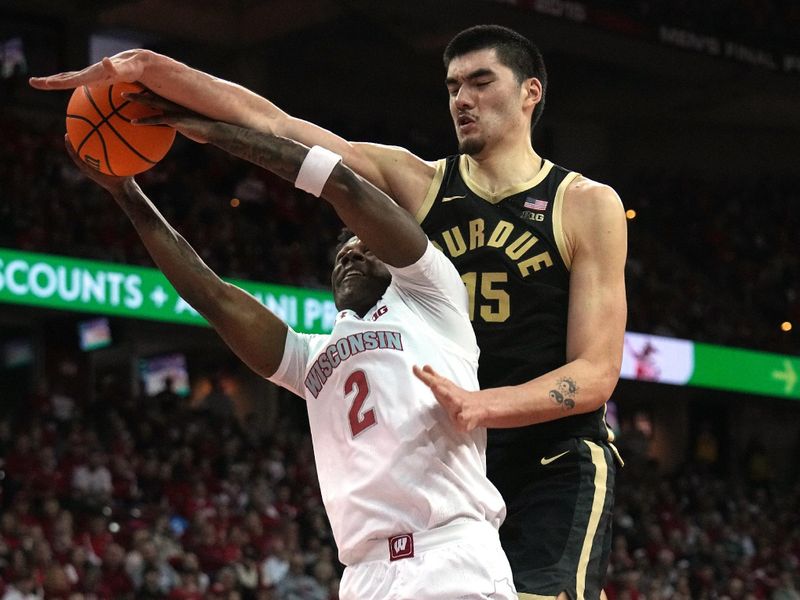 Feb 4, 2024; Madison, Wisconsin, USA; Purdue center Zach Edey (15) fouls Wisconsin guard AJ Storr (2) during the second half at Kohl Center. Mandatory Credit: Mark Hoffman-USA TODAY Sports