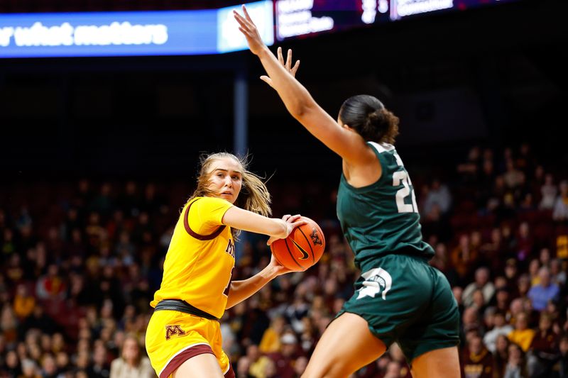 Jan 20, 2024; Minneapolis, Minnesota, USA; Minnesota Golden Gophers guard Mara Braun (10) catches a pass as Michigan State Spartans guard Moira Joiner (22) defends during the first half at Williams Arena. Mandatory Credit: Matt Krohn-USA TODAY Sports