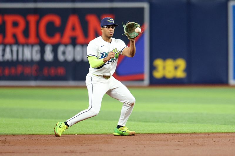 Jul 12, 2024; St. Petersburg, Florida, USA; Tampa Bay Rays second baseman Richie Palacios (1) fields the ball against the Cleveland Guardians in the second inning at Tropicana Field. Mandatory Credit: Nathan Ray Seebeck-USA TODAY Sports