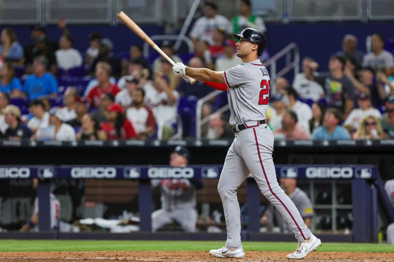 Sep 16, 2023; Miami, Florida, USA; Atlanta Braves first baseman Matt Olson (28) hits a home run against the Miami Marlins during the sixth inning at loanDepot Park. Mandatory Credit: Sam Navarro-USA TODAY Sports