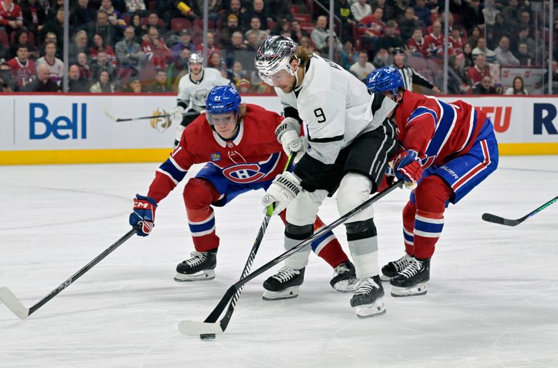 Dec 7, 2023; Montreal, Quebec, CAN; Los Angeles Kings forward Adrian Kempe (9) plays the puck as Montreal Canadiens defenseman Kaiden Guhle (21) defends with teammate Justin Barron (52) during the first period at the Bell Centre. Mandatory Credit: Eric Bolte-USA TODAY Sports