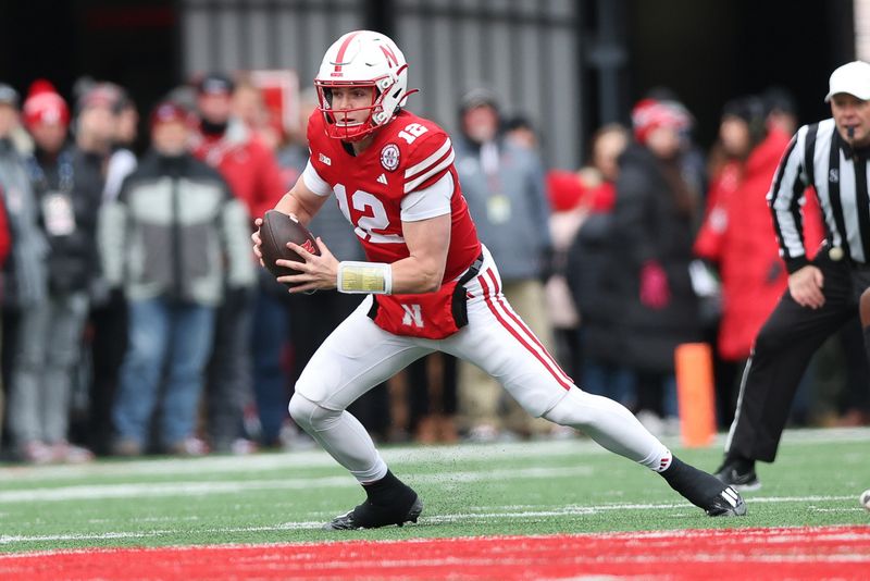 Nov 24, 2023; Lincoln, Nebraska, USA; Nebraska Cornhuskers quarterback Chubba Purdy (12) runs the football against the Iowa Hawkeyes at Memorial Stadium. Mandatory Credit: Reese Strickland-USA TODAY Sports