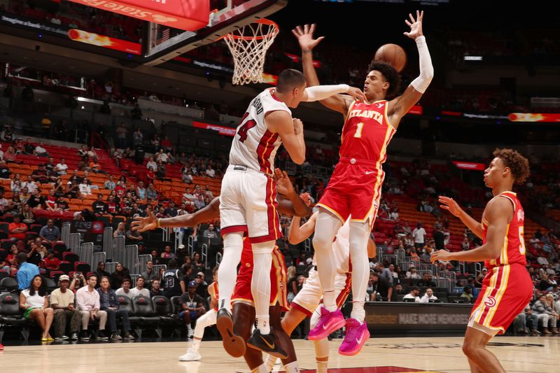 MIAMI, FL - OCTOBER 16: Tyler Herro #14 of the Miami Heat blocks the ball during the game against the Atlanta Hawks on October 16, 2024 at Miami-Dade Arena in Miami, Florida. NOTE TO USER: User expressly acknowledges and agrees that, by downloading and or using this Photograph, user is consenting to the terms and conditions of the Getty Images License Agreement. Mandatory Copyright Notice: Copyright 2024 NBAE (Photo by Issac Baldizon/NBAE via Getty Images)