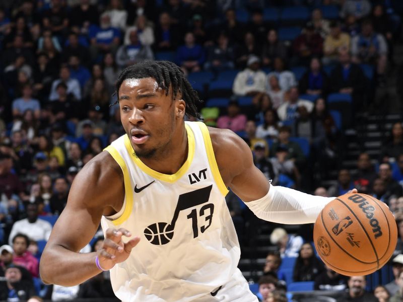 ORLANDO, FL - JANUARY 5 : Isaiah Collier #13 of the Utah Jazz dribbles the ball during the game against the Orlando Magic  on January 5, 2025 at Kia Center in Orlando, Florida. NOTE TO USER: User expressly acknowledges and agrees that, by downloading and or using this photograph, User is consenting to the terms and conditions of the Getty Images License Agreement. Mandatory Copyright Notice: Copyright 2025 NBAE (Photo by Fernando Medina/NBAE via Getty Images)