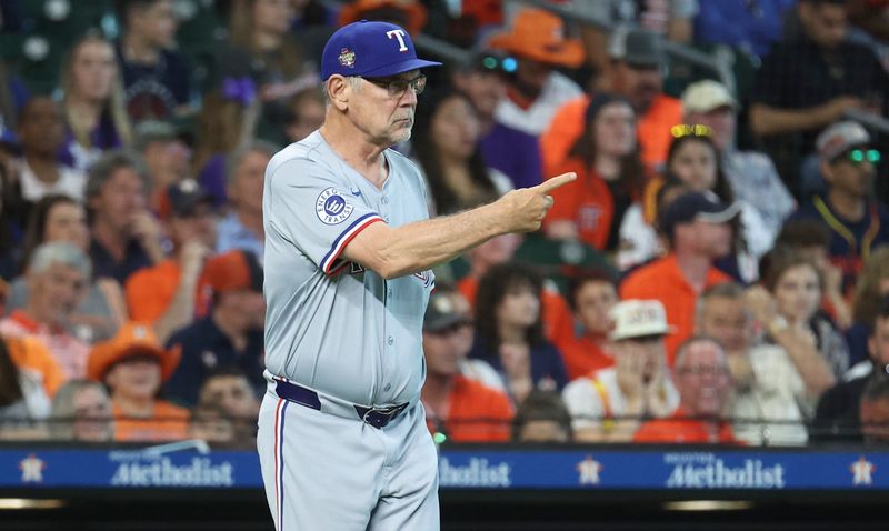 Apr 14, 2024; Houston, Texas, USA; Texas Rangers manager Bruce Bochy (15) motions for a pitching change during the seventh inning against the Houston Astros at Minute Maid Park. Mandatory Credit: Troy Taormina-USA TODAY Sports