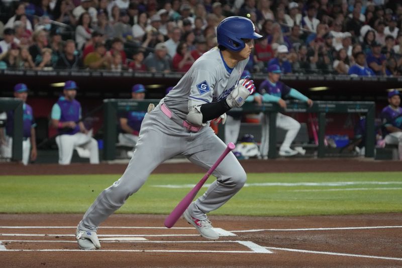 May 11, 2025; Phoenix, Arizona, USA; Los Angeles Dodgers two-way player Shohei Ohtani (17) hits against the Arizona Diamondbacks in the first inning at Chase Field. Mandatory Credit: Rick Scuteri-Imagn Images