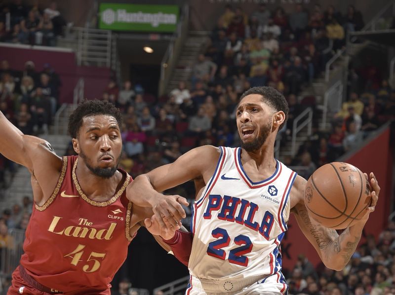 CLEVELAND, OH - FEBRUARY 12: Cameron Payne #22 of the Philadelphia 76ers handles the ball against Donovan Mitchell #45 of the Cleveland Cavaliers during the game on February 12, 2024 at Rocket Mortgage FieldHouse in Cleveland, Ohio. NOTE TO USER: User expressly acknowledges and agrees that, by downloading and/or using this Photograph, user is consenting to the terms and conditions of the Getty Images License Agreement. Mandatory Copyright Notice: Copyright 2024 NBAE (Photo by David Liam Kyle/NBAE via Getty Images)