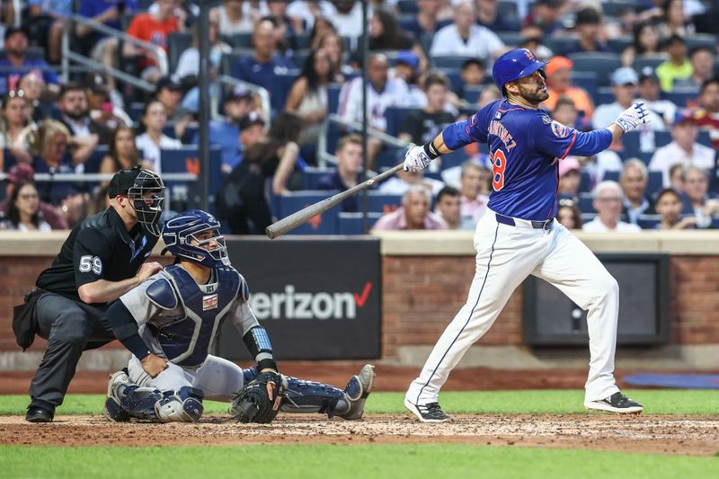 Jun 26, 2024; New York City, New York, USA;  New York Mets designated hitter J.D. Martinez (28) hits an RBI single in the third inning against the New York Yankees at Citi Field. Mandatory Credit: Wendell Cruz-USA TODAY Sports