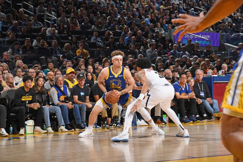 SAN FRANCISCO, CA - JANUARY 4: Brandin Podziemski #2 of the Golden State Warriors looks to pass the ball during the game against the Denver Nuggets on January 4, 2024 at Chase Center in San Francisco, California. NOTE TO USER: User expressly acknowledges and agrees that, by downloading and or using this photograph, user is consenting to the terms and conditions of Getty Images License Agreement. Mandatory Copyright Notice: Copyright 2024 NBAE (Photo by Noah Graham/NBAE via Getty Images)