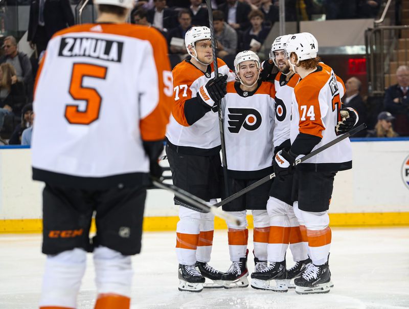 Apr 11, 2024; New York, New York, USA; Philadelphia Flyers right wing Bobby Brink (10) celebrates his goal against the New York Rangers with defenseman Erik Johnson (77), center Ryan Poehling (25) and right wing Owen Tippett (74) during the second period at Madison Square Garden. Mandatory Credit: Danny Wild-USA TODAY Sports