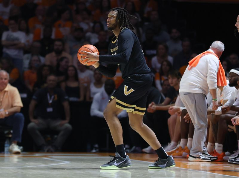 Mar 7, 2026; Knoxville, Tennessee, USA;  Vanderbilt Commodores forward Devin McGlockton (99) moves the ball against the Tennessee Volunteers during the first half at Thompson-Boling Arena at Food City Center. Mandatory Credit: Randy Sartin-Imagn Images