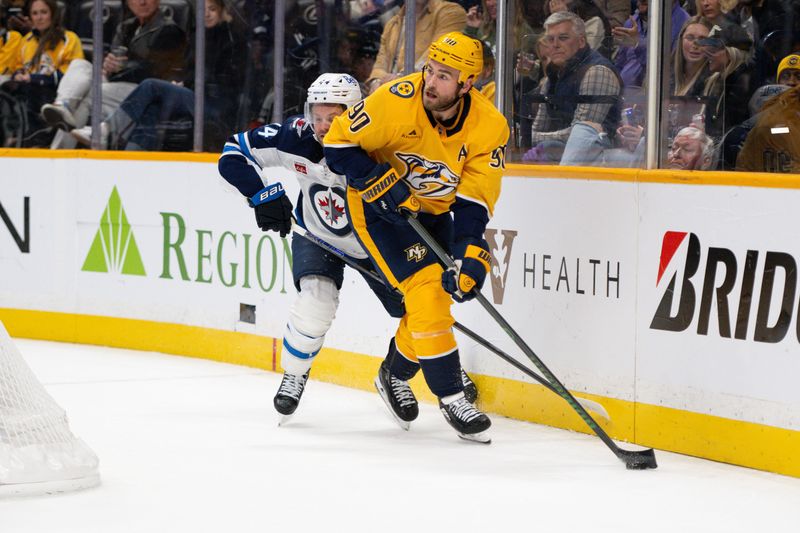 Nov 23, 2024; Nashville, Tennessee, USA;  Nashville Predators center Ryan O'Reilly (90) skates behind the net against the Winnipeg Jets during the third period at Bridgestone Arena. Mandatory Credit: Steve Roberts-Imagn Images