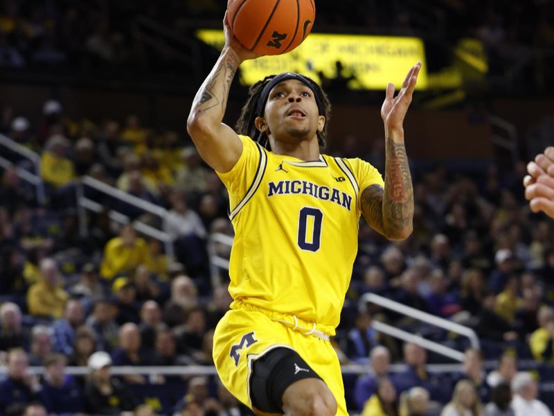 Feb 25, 2024; Ann Arbor, Michigan, USA;  Michigan Wolverines guard Dug McDaniel (0) shoots in the first half against the Purdue Boilermakers at Crisler Center. Mandatory Credit: Rick Osentoski-USA TODAY Sports