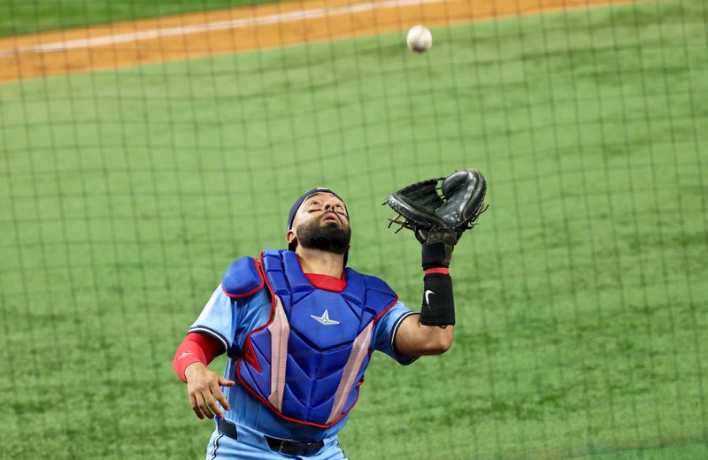 May 28, 2025; Arlington, Texas, USA; Toronto Blue Jays catcher Ali Sanchez (20) makes a catch during the eighth inningagainst the Texas Rangers at Globe Life Field. Mandatory Credit: Kevin Jairaj-Imagn Images