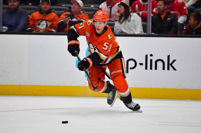 Nov 15, 2024; Anaheim, California, USA; Anaheim Ducks defenseman Olen Zellweger (51) moves the puck against the Detroit Red Wings during the third period at Honda Center. Mandatory Credit: Gary A. Vasquez-Imagn Images
