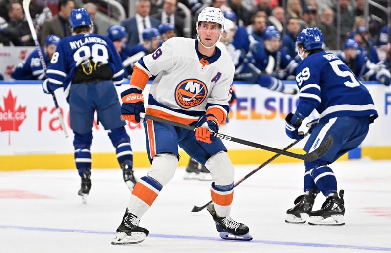 Feb 5, 2024; Toronto, Ontario, CAN;   New York Islanders forward Brock Nelson (29) skates against the Toronto Maple Leafs in the first period at Scotiabank Arena. Mandatory Credit: Dan Hamilton-USA TODAY Sports