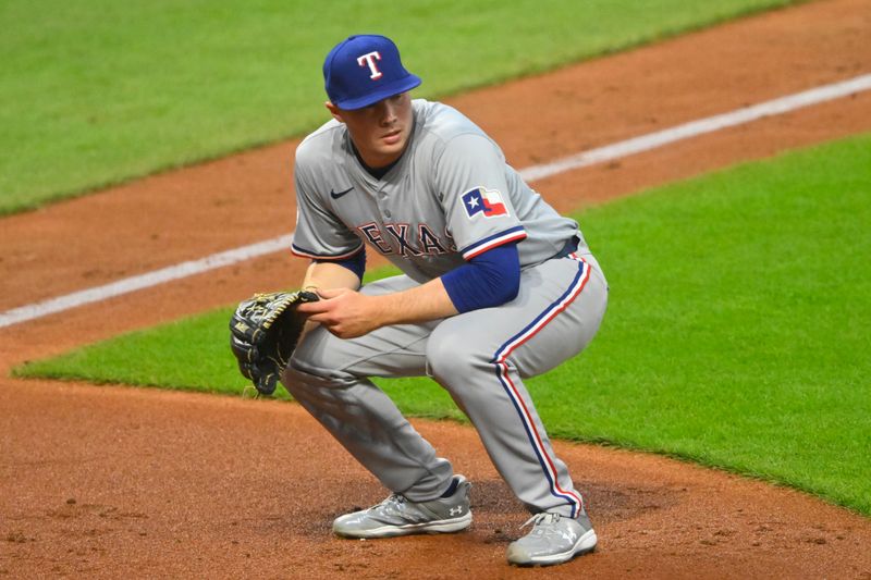 Aug 24, 2024; Cleveland, Ohio, USA; Texas Rangers relief pitcher Walter Pennington (52) reacts after a passed ball allowed a Cleveland Guardians run to score in the third inning at Progressive Field. Mandatory Credit: David Richard-USA TODAY Sports