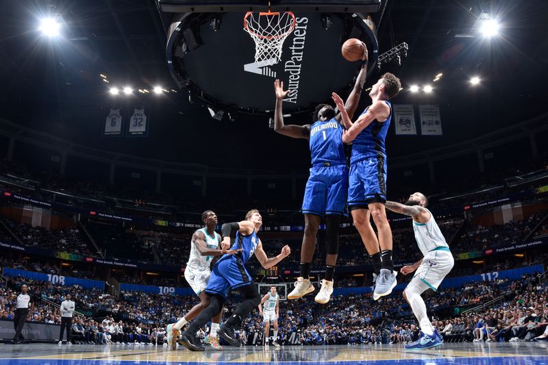 ORLANDO, FL - NOVEMBER 12: Jonathan Isaac #1 of the Orlando Magic rebounds the ball during the Emirates NBA Cup game against the Charlotte Hornets on November 12, 2024 at Kia Center in Orlando, Florida. NOTE TO USER: User expressly acknowledges and agrees that, by downloading and or using this photograph, User is consenting to the terms and conditions of the Getty Images License Agreement. Mandatory Copyright Notice: Copyright 2024 NBAE (Photo by Fernando Medina/NBAE via Getty Images)