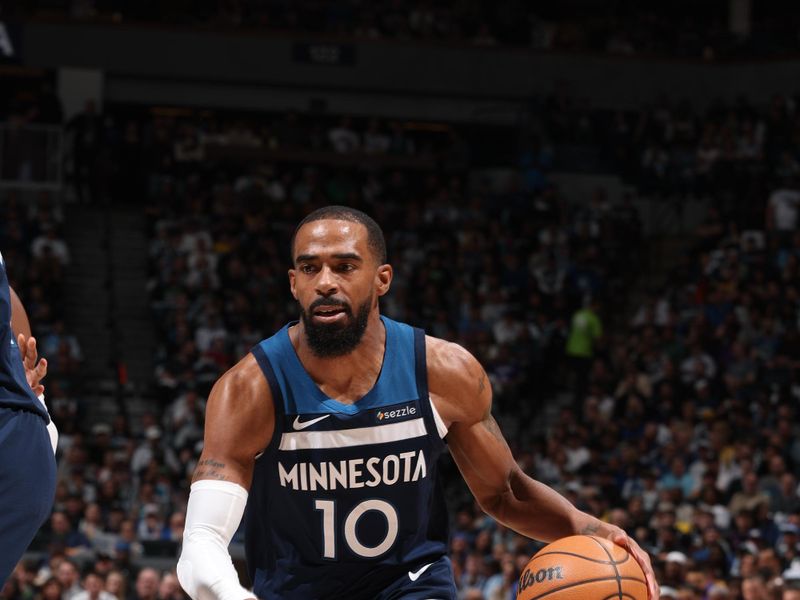MINNEAPOLIS, MN -  APRIL  27: Mike Conley #10 of the Minnesota Timberwolves drives to the basket during the game against the Los Angeles Lakers  during Round 1 Game 4 of the 2025 NBA Playoffs  on April 27, 2025 at Target Center in Minneapolis, Minnesota. NOTE TO USER: User expressly acknowledges and agrees that, by downloading and or using this Photograph, user is consenting to the terms and conditions of the Getty Images License Agreement. Mandatory Copyright Notice: Copyright 2025 NBAE (Photo by David Sherman/NBAE via Getty Images)