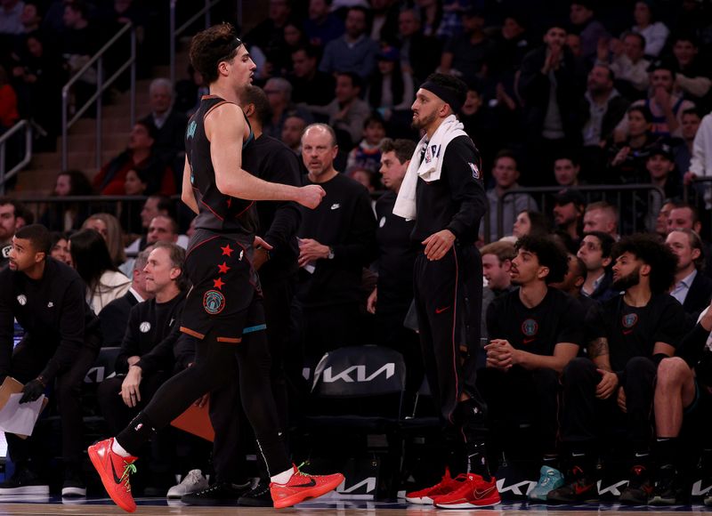 NEW YORK, NEW YORK - JANUARY 18:  Deni Avdija #8 of the Washington Wizards is consoled by teammate Landry Shamet #20 of the Washington Wizards after Avdija was taken out of the game after his sixth foul in the game against the New York Knicks at Madison Square Garden on January 18, 2024 in New York City. NOTE TO USER: User expressly acknowledges and agrees that, by downloading and or using this photograph, User is consenting to the terms and conditions of the Getty Images License Agreement (Photo by Elsa/Getty Images)