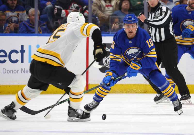 Mar 25, 2026; Buffalo, New York, USA; Boston Bruins defenseman Jonathan Aspirot (45) makes a pass as Buffalo Sabres center Sam Carrick (10) defends during the second period at KeyBank Center. Mandatory Credit: Timothy T. Ludwig-Imagn Images Mar 25, 2026; Buffalo, New York, USA; Boston Bruins defenseman Jonathan Aspirot (45) makes a pass as Buffalo Sabres center Sam Carrick (10) defends during the second period at KeyBank Center. Mandatory Credit: Timothy T. Ludwig-Imagn Images