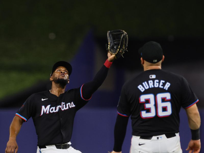 Jul 19, 2024; Miami, Florida, USA; Miami Marlins second baseman Otto Lopez (61) catches a fly ball against the New York Mets during the ninth inning at loanDepot Park. Mandatory Credit: Sam Navarro-USA TODAY Sports